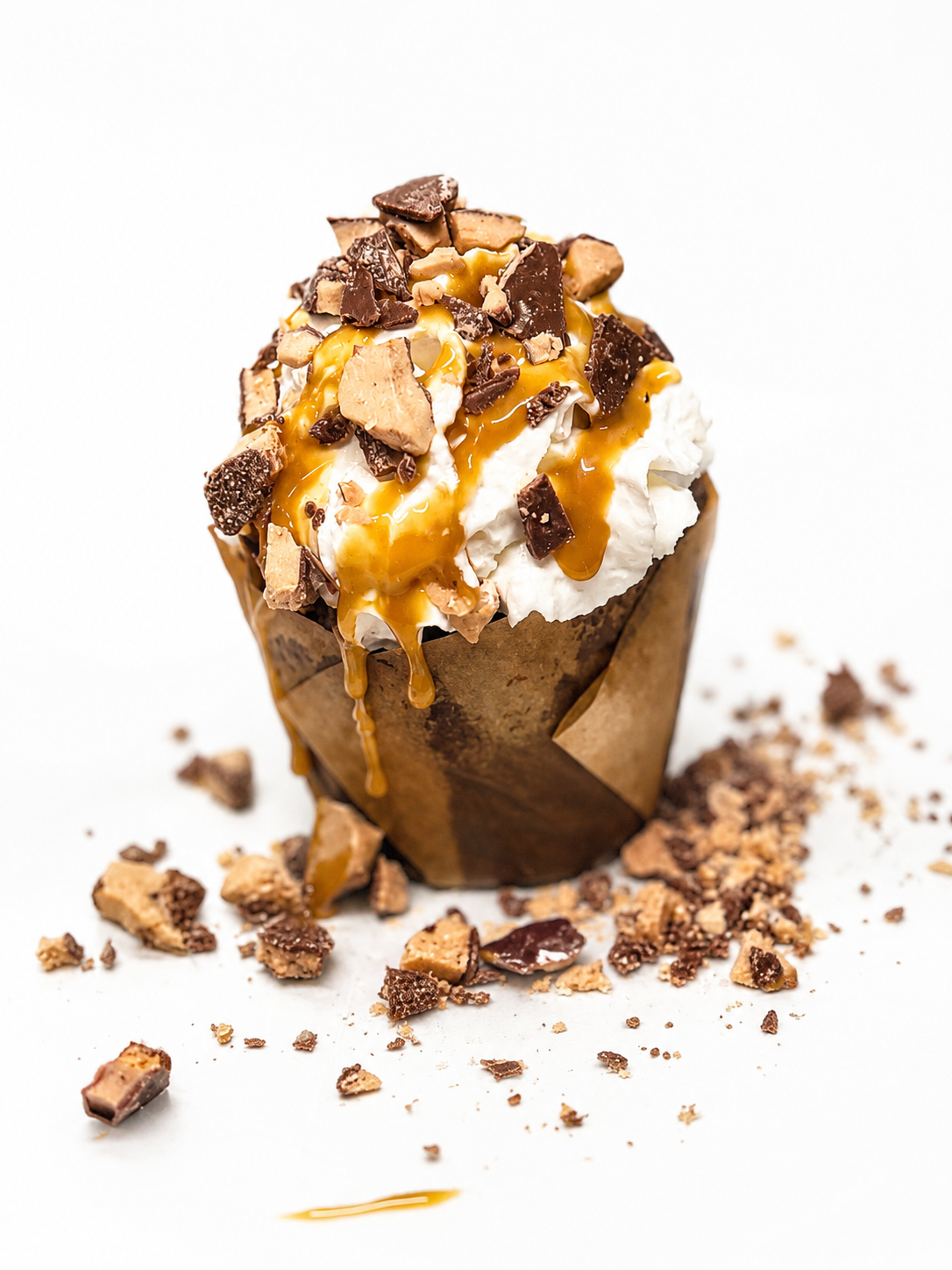 The Guilty Pleasure triple chocolate chip brownie cup topped with bourbon butterscotch, Heath crumble, and whipped cream